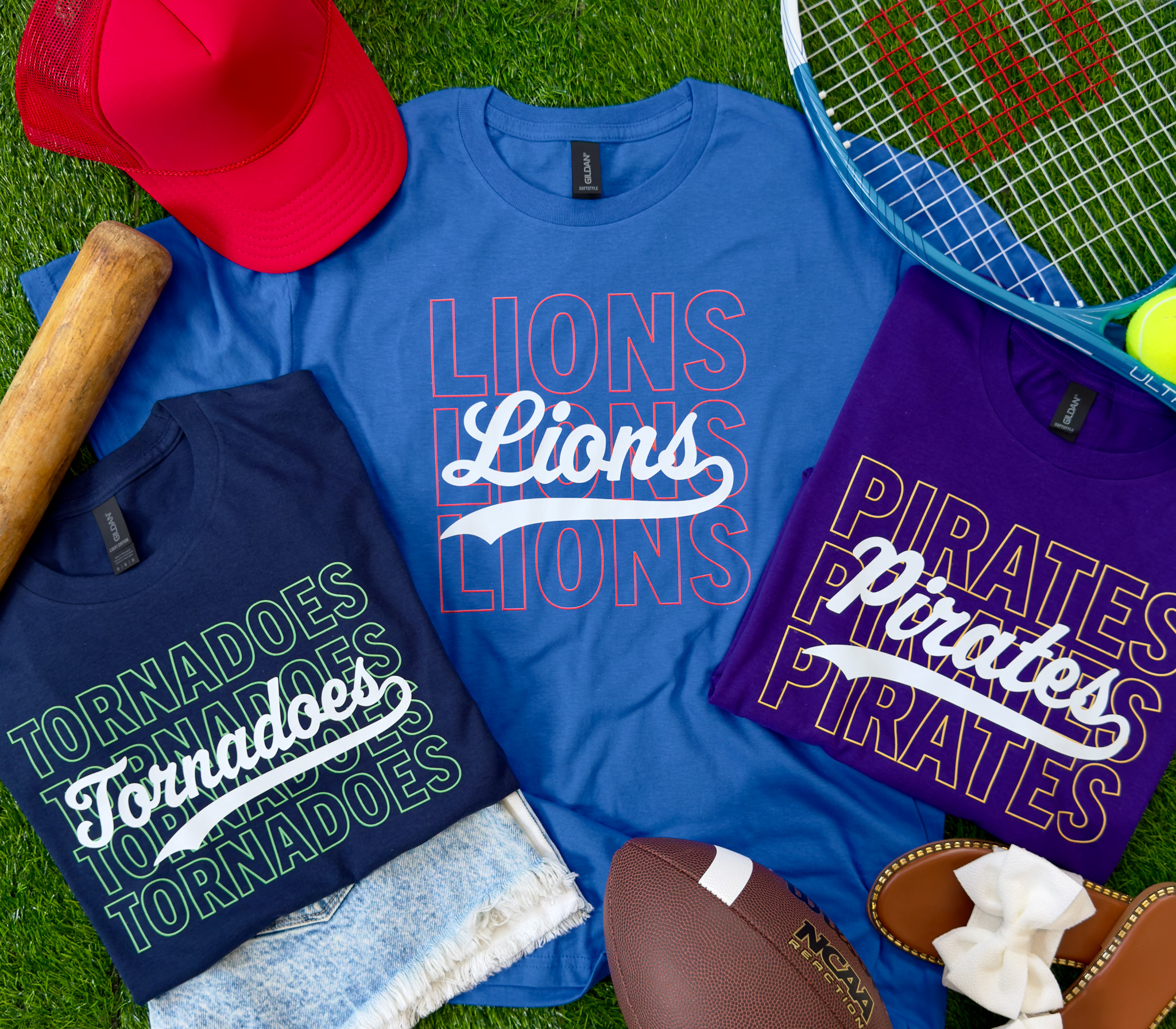 Colorful custom-printed team shirts arranged with sports equipment
