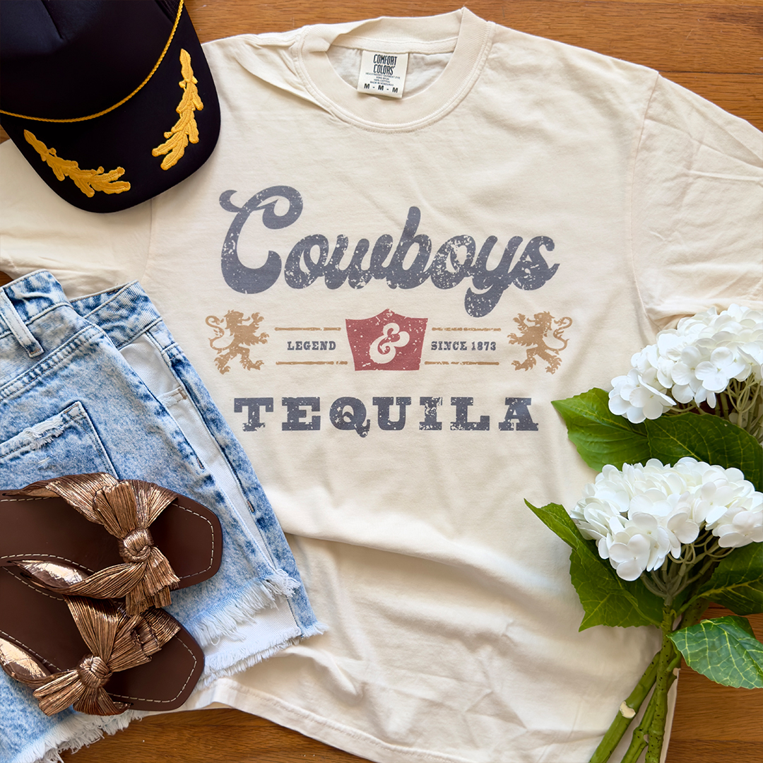 Custom-printed Cowboys T-shirt arranged with apparel and flowers