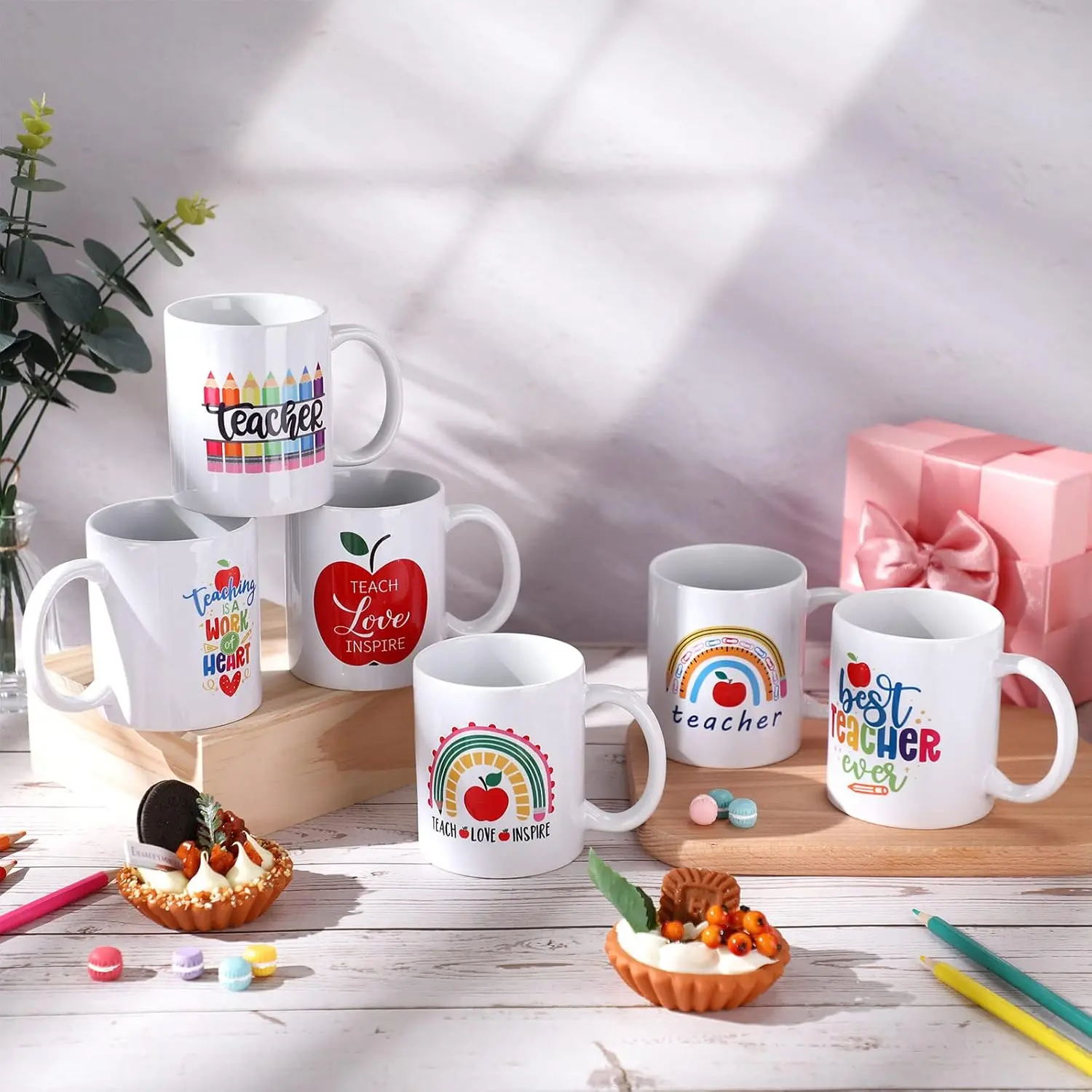 Collection of colorful custom-sublimated teacher mugs
